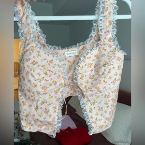 Rumours tie tank top size medium. Light pink with floral design.